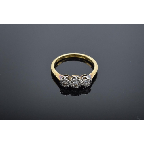 224 - 18ct gold and platinum 3 stone ring with illusion set diamonds, 2.8 grams total weight.