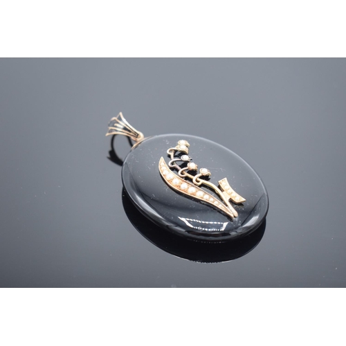 240 - Victorian jet and pearl locket-back mourning pendant, 6cm.