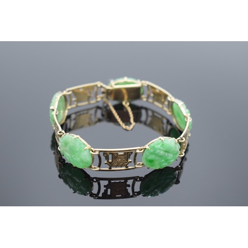 245 - 9ct gold carved jade bracelet, gross weight 14.6 grams