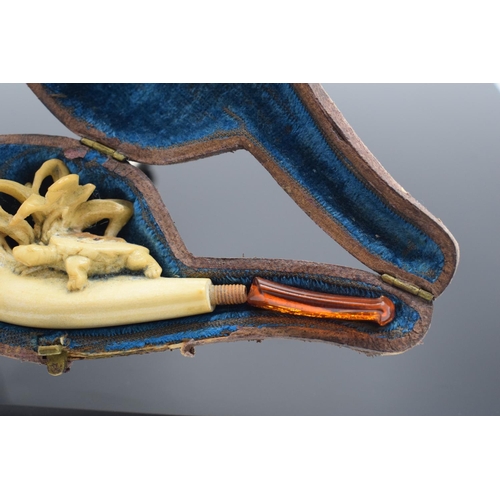 247 - Cased meerschaum pipe with a turtle decoration. The mouth piece is a/f and there is damage to the de... 