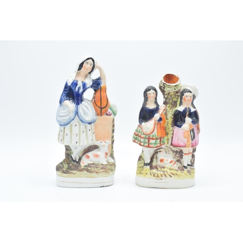 290 - 19th century Staffordshire flatbacks to include a lady with a lamb and a Scottish spill vase (2). We... 