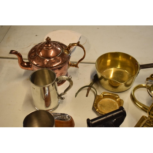 293 - A mixed collection of metalware to include a brass saucepan, an iron, silver plate etc. in mixed con... 