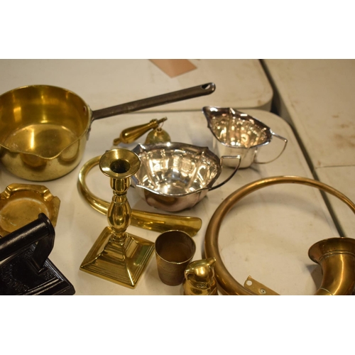 293 - A mixed collection of metalware to include a brass saucepan, an iron, silver plate etc. in mixed con... 