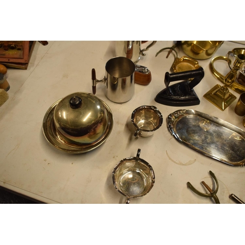 293 - A mixed collection of metalware to include a brass saucepan, an iron, silver plate etc. in mixed con... 