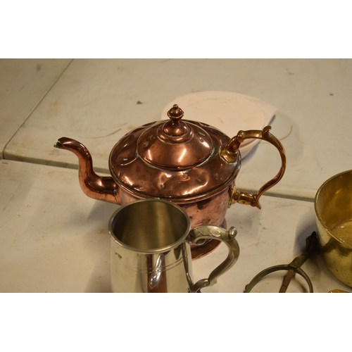 293 - A mixed collection of metalware to include a brass saucepan, an iron, silver plate etc. in mixed con... 