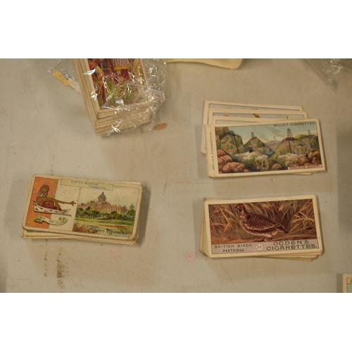 298 - A collection of 20th century cigarette and tea cards to include silk examples, Wills etc (mainly WWI... 