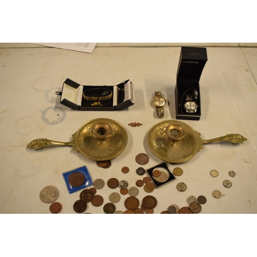 299 - A mixed collection of items to include watches, brass candle holders, uk and other coinage to includ... 