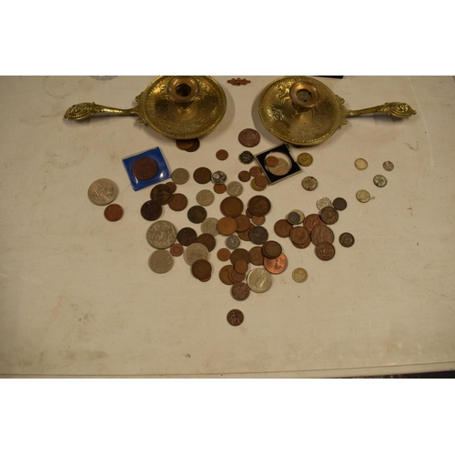 299 - A mixed collection of items to include watches, brass candle holders, uk and other coinage to includ... 