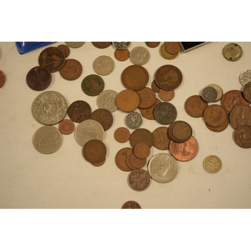 299 - A mixed collection of items to include watches, brass candle holders, uk and other coinage to includ... 