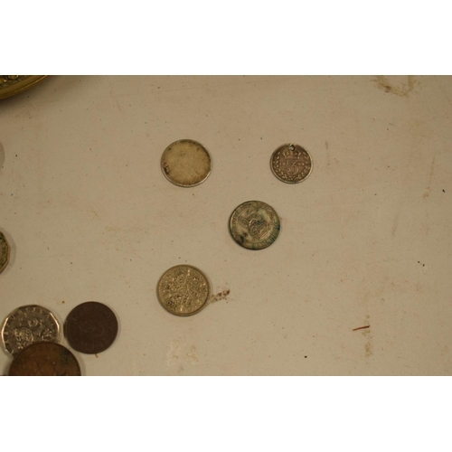 299 - A mixed collection of items to include watches, brass candle holders, uk and other coinage to includ... 