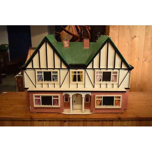 304 - Large 20th century wooden dolls house with 6 rooms, opens from the back. With electrics which will n... 