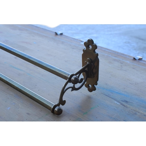 309 - Reproduction brass towel rail in a Victorian style, 67cm long.