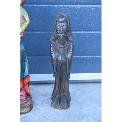 312 - 20th century carved wooden figures to include a religious example (2). Tallest 60cm.