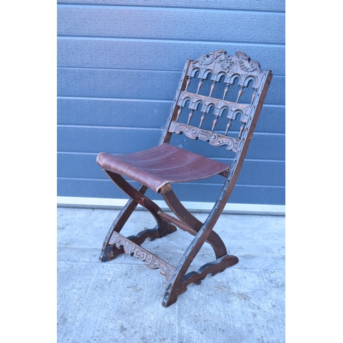 318 - A heavily carved chair with an upholstered seat in the Wainscot style. Generally good condition, mis... 