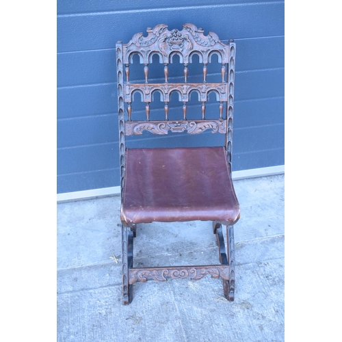 318 - A heavily carved chair with an upholstered seat in the Wainscot style. Generally good condition, mis... 