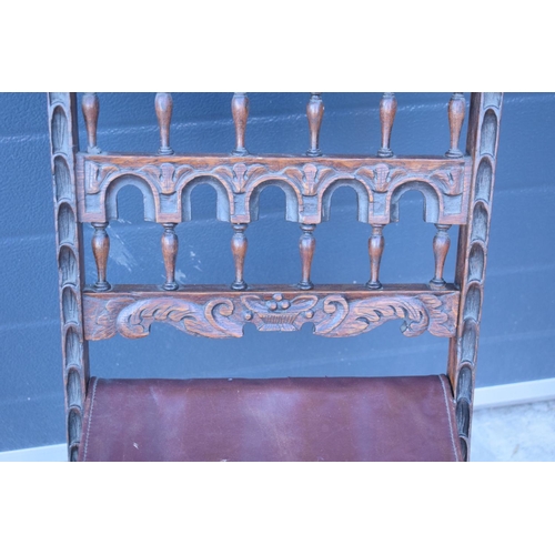 318 - A heavily carved chair with an upholstered seat in the Wainscot style. Generally good condition, mis... 