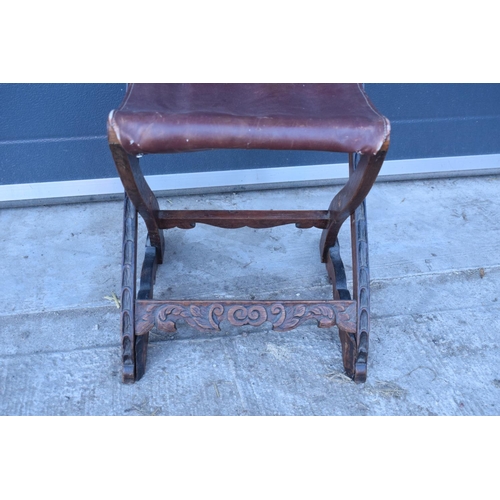 318 - A heavily carved chair with an upholstered seat in the Wainscot style. Generally good condition, mis... 