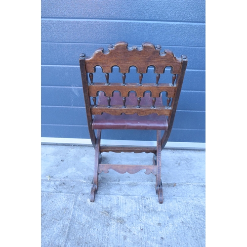 318 - A heavily carved chair with an upholstered seat in the Wainscot style. Generally good condition, mis... 