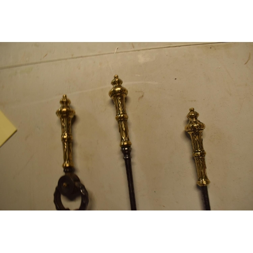 328 - Brass and metal fire companion set (heavy duty). No postage, condition reports or extra photos are a... 