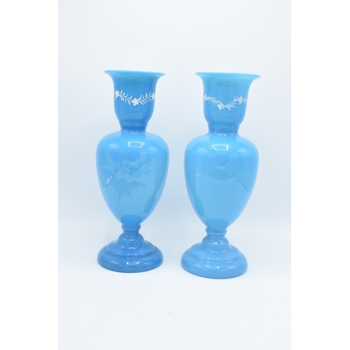 54 - A pair of large blue painted glass vases with floral scenes. In good condition with no obvious damag... 