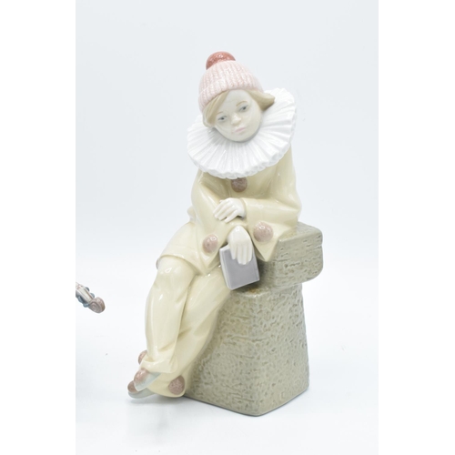 58 - Lladro figures to include Little Jester 5203 and The Blues Clown 5600 (a/f) (2). The violin bow has ... 