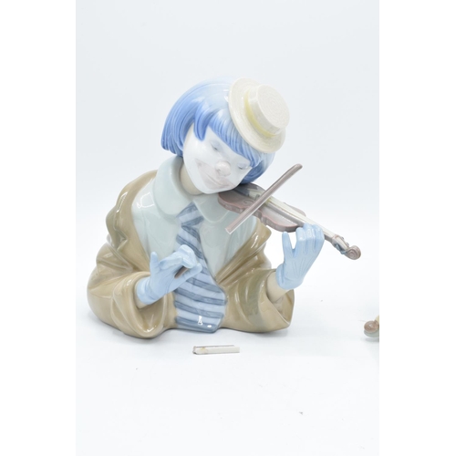 58 - Lladro figures to include Little Jester 5203 and The Blues Clown 5600 (a/f) (2). The violin bow has ... 