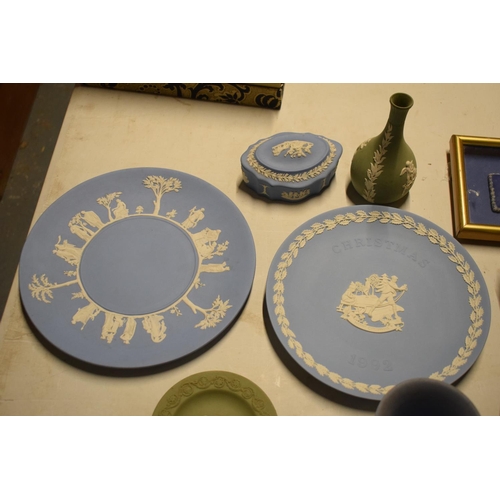 64 - A collection of Wedgwood Jasperware including a framed dip blue lid, plates vases etc (9)