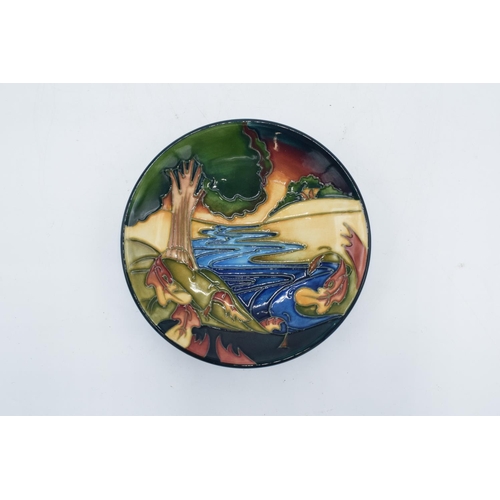 80 - Moorcroft pin tray with a woodland and stream scene. Marked with silver line for seconds but in good... 