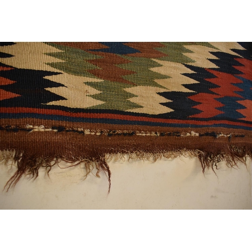 93 - 20th century carpet, believed to be a Persian Kilim flat weave. Approximately 167 x 303cm.  There is... 