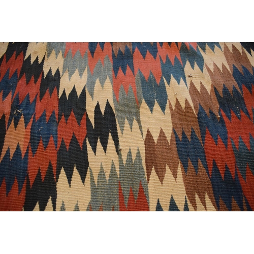 93 - 20th century carpet, believed to be a Persian Kilim flat weave. Approximately 167 x 303cm.  There is... 