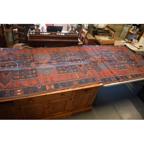 96 - Large 20th century wall hanging believed to be a  Persian Qashqai carpet with four blue ground lozen... 