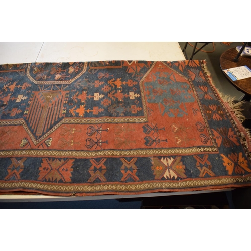 96 - Large 20th century wall hanging believed to be a  Persian Qashqai carpet with four blue ground lozen... 