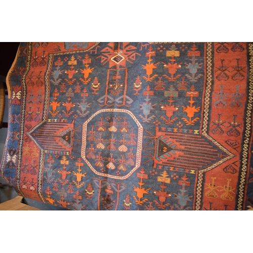 96 - Large 20th century wall hanging believed to be a  Persian Qashqai carpet with four blue ground lozen... 