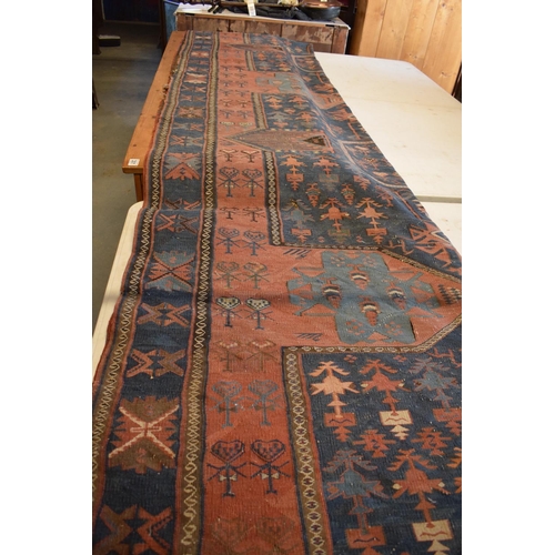 96 - Large 20th century wall hanging believed to be a  Persian Qashqai carpet with four blue ground lozen... 