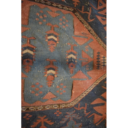 96 - Large 20th century wall hanging believed to be a  Persian Qashqai carpet with four blue ground lozen... 