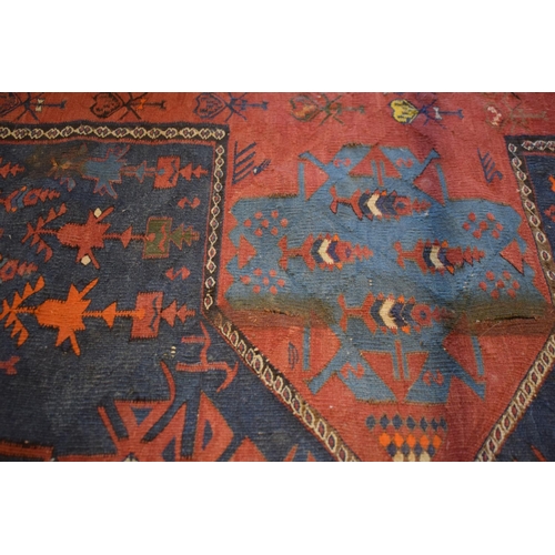 96 - Large 20th century wall hanging believed to be a  Persian Qashqai carpet with four blue ground lozen... 