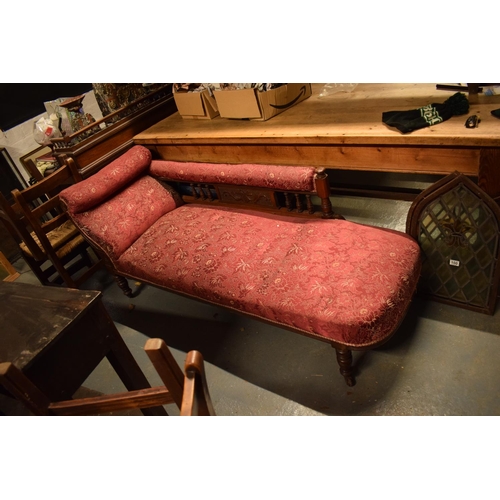 336 - Edwardian upholstered mahogany chaise-longue. The springs have gone spongey. Damage to the carving b... 