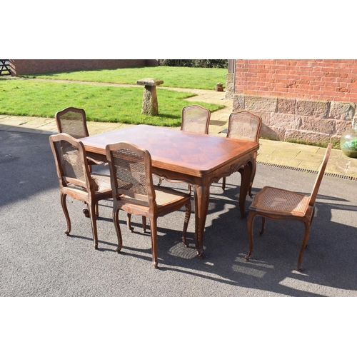 358 - Edwardian extending table together with 6 wicker-style back dining chairs (7). The table is in good ... 