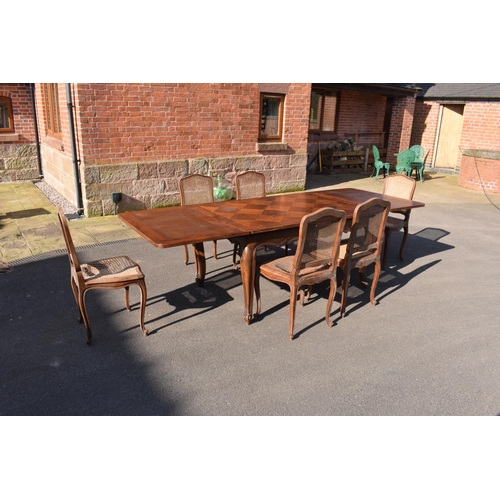 358 - Edwardian extending table together with 6 wicker-style back dining chairs (7). The table is in good ... 