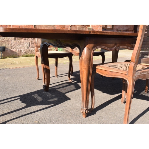 358 - Edwardian extending table together with 6 wicker-style back dining chairs (7). The table is in good ... 