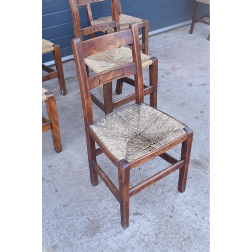 359 - A collection of 6 Victorian ladder back farmhouse chairs with rush seats (All near matching) (6). In... 