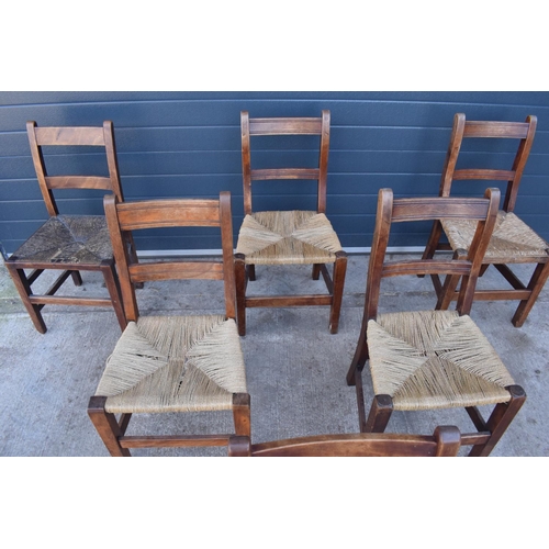 359 - A collection of 6 Victorian ladder back farmhouse chairs with rush seats (All near matching) (6). In... 