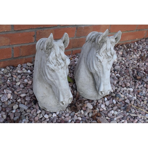 253 - Reconstituted stone pair of horses heads. 35cm tall. 

Made in England, these items are frost and we... 