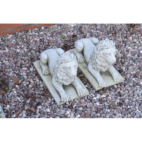 255 - Reconstituted stone models of lions laying down. 

Made in England, these items are frost and weathe... 