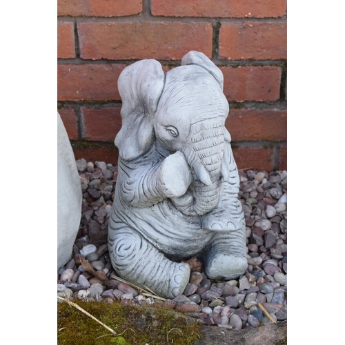 258 - Reconstituted stone model of an elephant. 32cm tall. 

Made in England, these items are frost and we... 