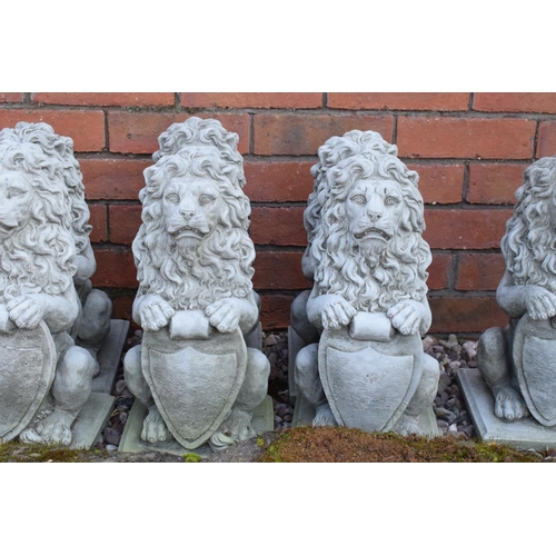 259 - Reconstituted stone small pair of upright lions. 41cm tall. 

Made in England, these items are frost... 