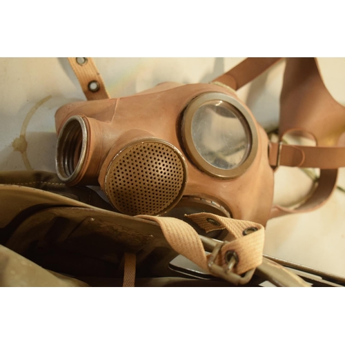 265 - World War 2 baby gas mask together with 2 face gas masks (3)