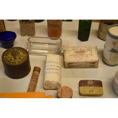 286 - A quantity of interesting early 20th century medicine and pesticide bottles, tins and jars etc (Some... 