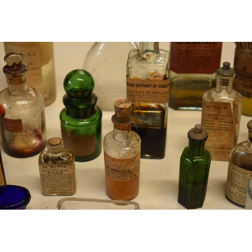 286 - A quantity of interesting early 20th century medicine and pesticide bottles, tins and jars etc (Some... 