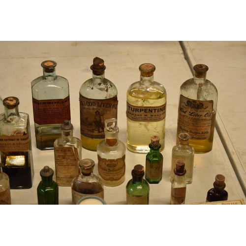 286 - A quantity of interesting early 20th century medicine and pesticide bottles, tins and jars etc (Some... 